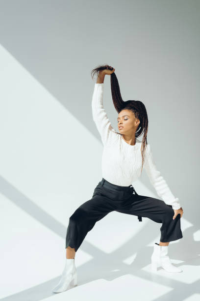 istock girl in knitted sweater and pants 870404986
