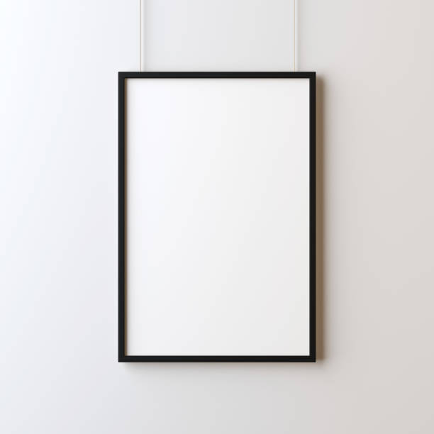 istock White blank poster with black frame mockup hanging on the wall 870404990