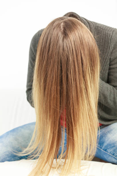 istock Girl hiding face behind hairs. 870405950