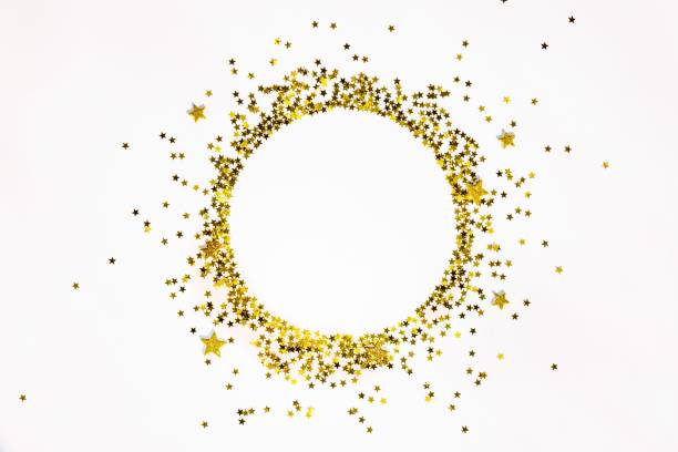 istock Star shaped golden sequins frame arranged in circle. 870408216