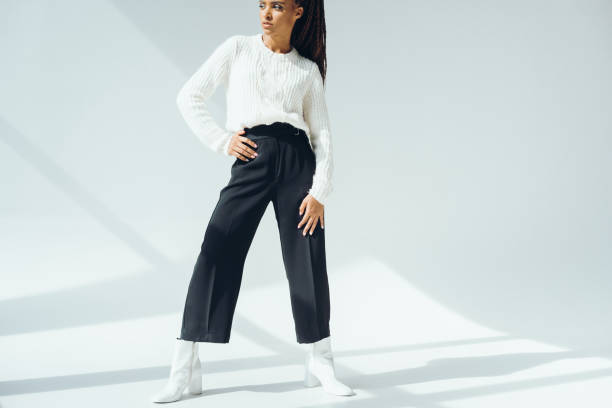 istock girl in trendy black pants 870409518