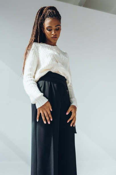 istock girl in trendy black pants 870412964