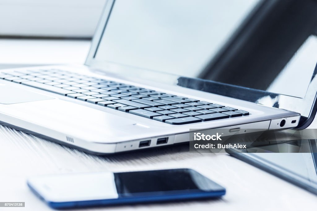 Laptop with tablet and smartphone Laptop with tablet and smartphone on white background Laptop Stock Photo