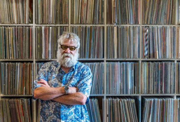 istock Record collector in front of his collection 870413398