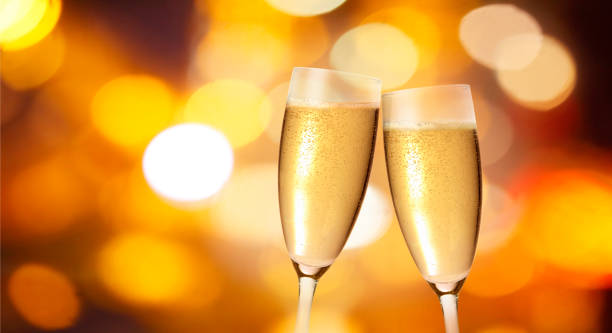 istock Champagne glasses on sparkling background 870413998