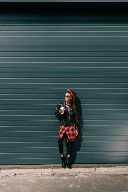 istock stylish girl with coffee to go 870417470