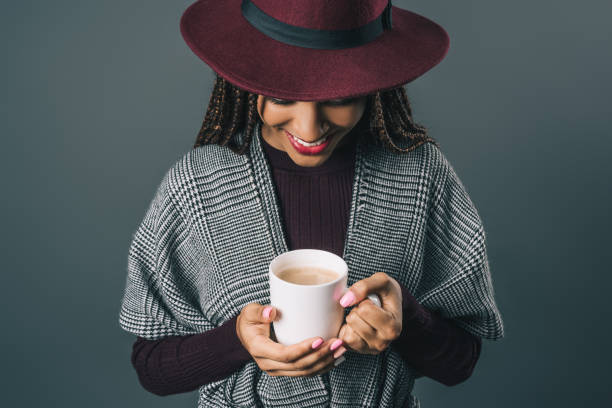 istock african american girl holding cup 870419172