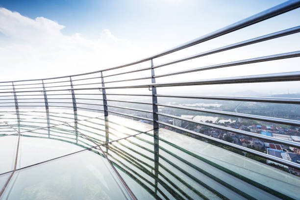 istock glass pedestrian bridge over hill 870420212
