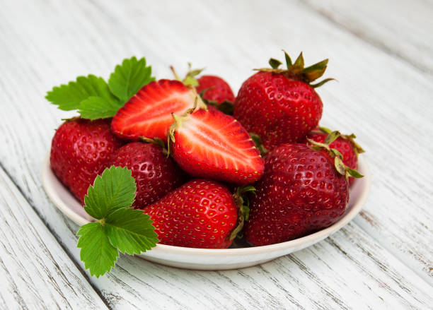 istock ripe strawberries on wooden table 870422752