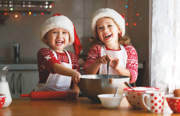istock happy children bake christmas cookies 870426758