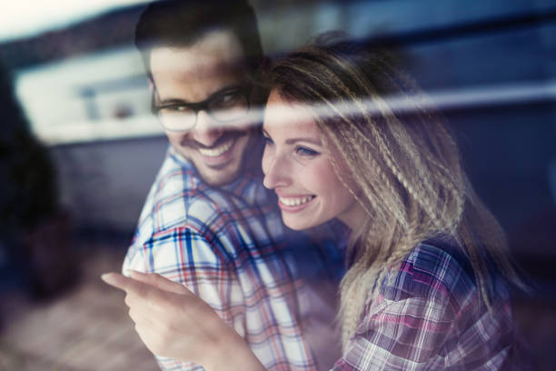 istock Beautiful young couple hugging and smiling together 870426782