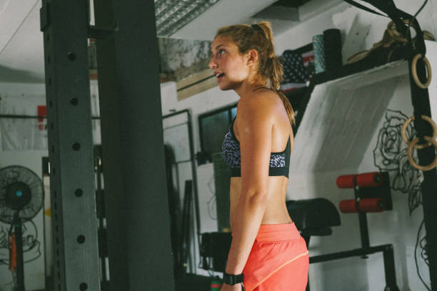 istock Sportswoman preparing for next exercise at gym 870427644
