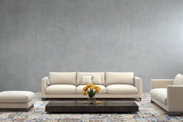 istock Modern white sofa in front of blank gray wall - interior copy space template 870427854