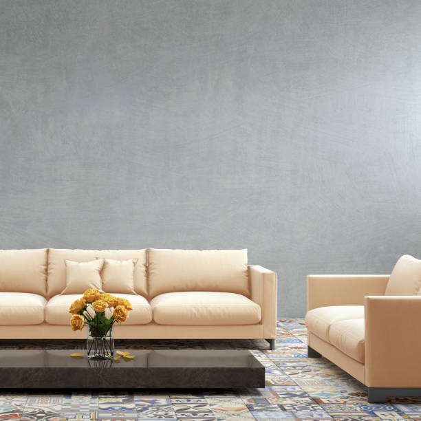 istock Modern orange pastel sofa in front of blank gray wall - interior copy space template 870427882