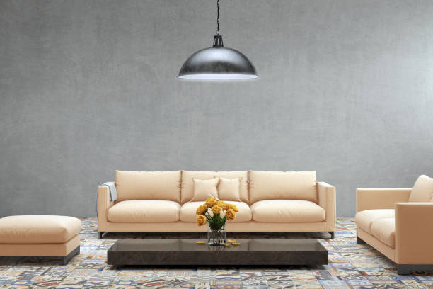 istock Modern orange pastel sofa in front of blank gray wall - interior copy space template 870427886