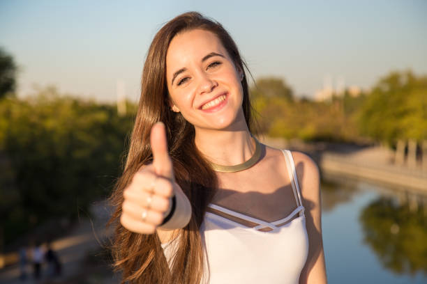 istock Woman gesturing thumb up 870430786