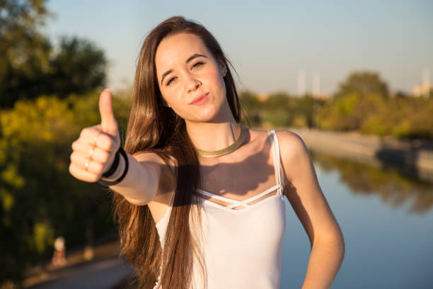 istock Woman gesturing thumb up 870430800