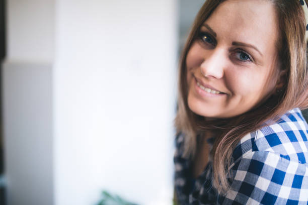 istock friendly smiling young woman portrait 870434138