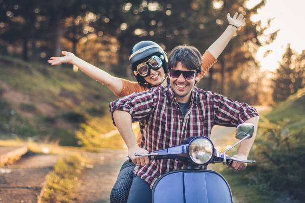 istock Happy couple on a scooter at summer vacation 870434632