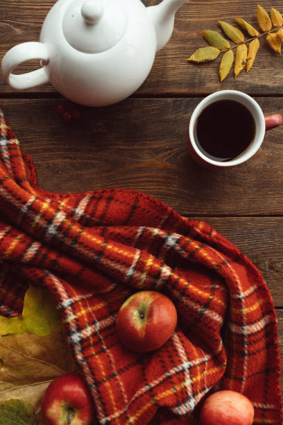istock autumn tea warmth leaf ripe wooden surface concept 870434664
