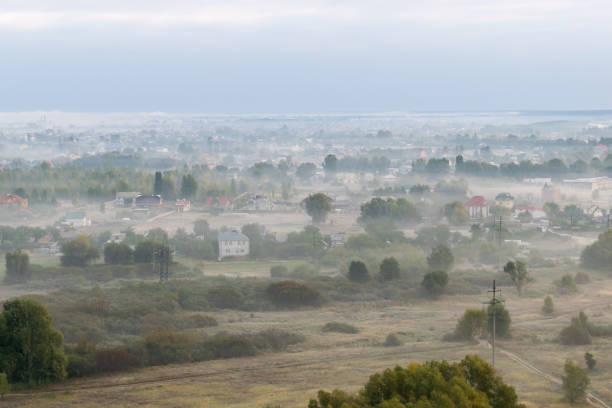 istock Village in fog 870448602