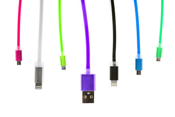 istock Eight multicolored usb cables, with connectors for micro and for iphone or ipad, hang vertically, on a white isolated background. The family unites. future technologies. Horizontal frame 870453104