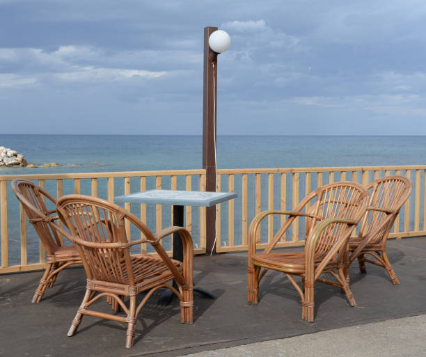 istock Table and chairs by the sea 870459880