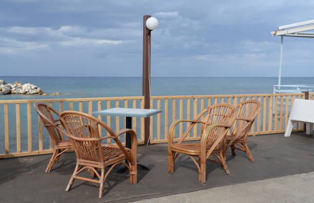 istock Table and chairs by the sea 870459906