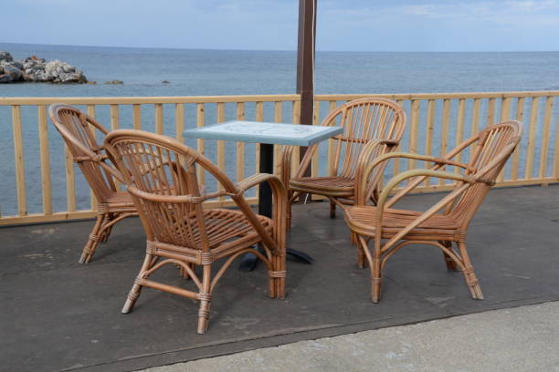 istock Table and chairs by the sea 870460094