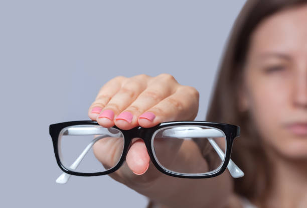 istock A woman holds a glasses in her hand 870471536