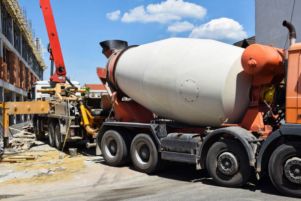 istock Cement mixer truck at the construction site 870471548