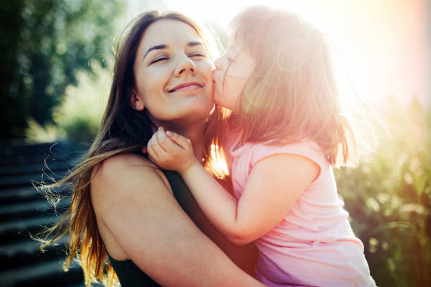 istock Little girl with special needs enjoy spending time with mother 870475008