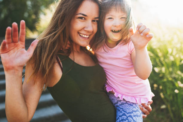 istock Little girl with special needs enjoy spending time with mother 870477064