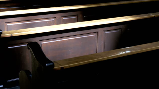 Wooden Pews in a Christian Church Aisle