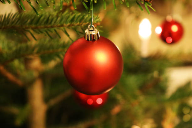 istock Red bauble on christmas tree, close-up 870478868