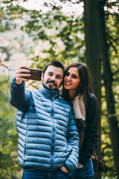 istock Couple taking selfies in a park! 870482150