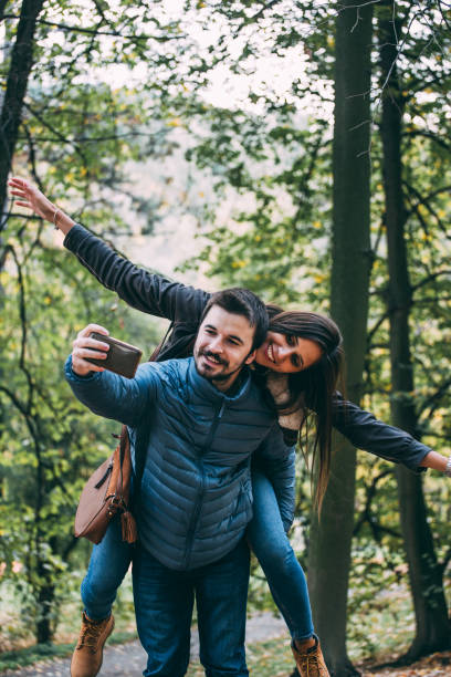 istock Couple taking selfies in a park! 870484318
