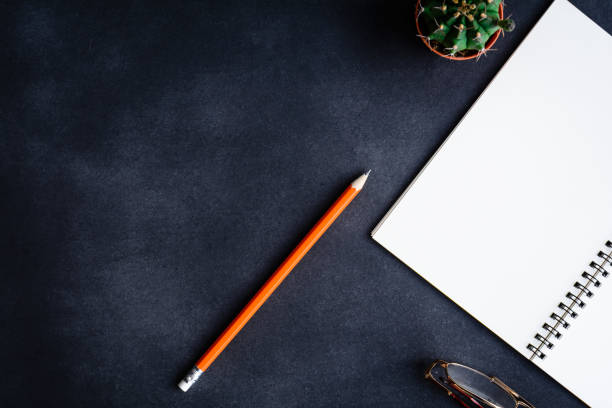 istock top view notebook and pencil glasses on the desk 870486482