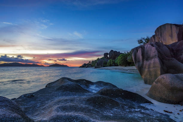 istock romantic sunset in paradise, silver spring cove, the dike, seychelles 20 870501060