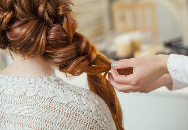 Beautiful Redhaired Girl With Long Hair Hairdresser Weaves A French Braid  Stock Photo - Download Image Now - iStock