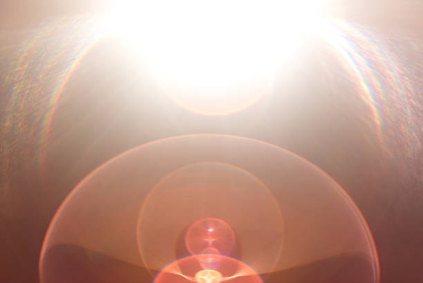 istock Lens flare light over black background. 870506964
