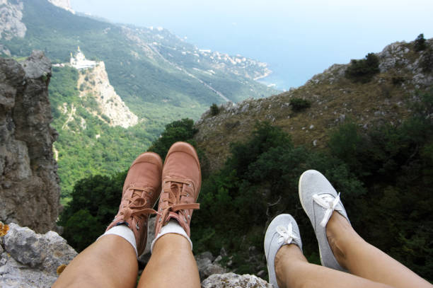 istock Woman feet over mountains 870507330