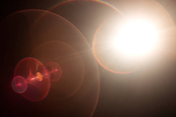 istock Lens flare light over black background. 870507414