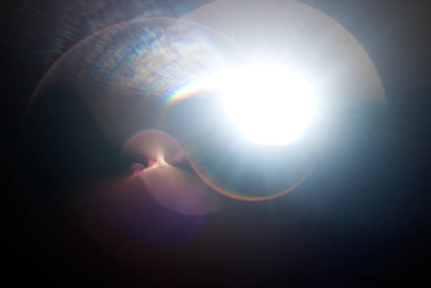 istock Lens flare light over black background. 870510660