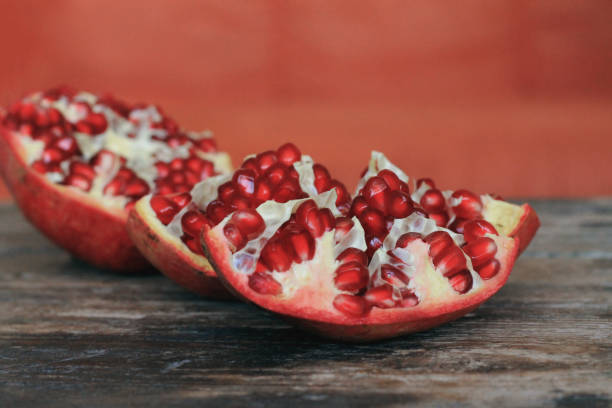 istock Fresh pomegranate on wooden table 870510844