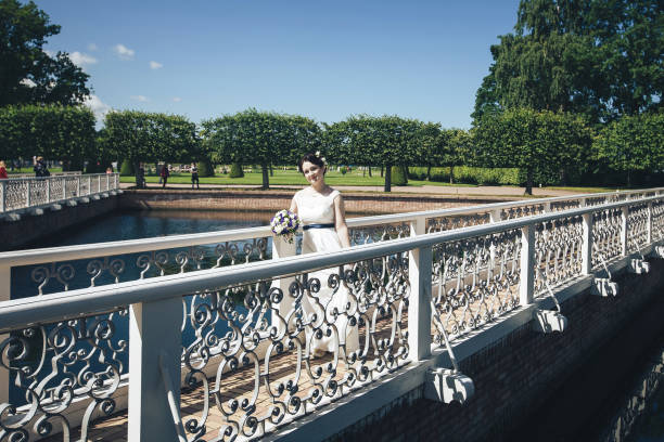 istock Bride in Wedding Dress with Wedding Bouquet 870514182