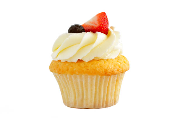 istock Cupcake with whipped cream, fresh strawberry, blueberry. 870531090