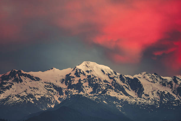 istock Sunset evening view over the snowy mountain peak 870531852