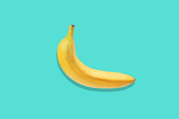 istock Fresh banana close up on bright blue background. Flat lay. Summer concept. 870531918