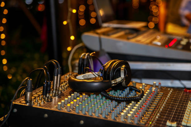 istock Dj mixer with headphones at party 870535320
